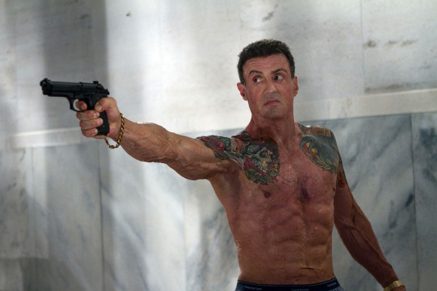 Sylvester Stallone shows off his sculpted, tattooed torso in Bullet To The Head.